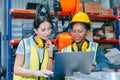 Women engineer worker working team training together at work in modern advanced robot welding machine factory Royalty Free Stock Photo