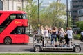 Women enjoying a fun day out in London UK. Iconic red London bus can also be seen in the photo.