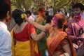 Women are enjoying Holi, the color festival of India.