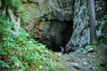 Women at the entrance of the cave