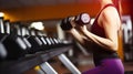 Women exercising lifts dumbbell in the gym. Generative AI