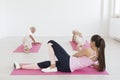 Women exercising on mats