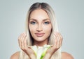 Women Face Spa. Young Woman with Clean Fresh Skin and White Lily Royalty Free Stock Photo