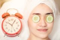 Women facial treatment in spa with time clock. Beauty times reverse to healthy skin to baby face anti aging cosmetic concept Royalty Free Stock Photo