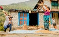 Women farmer is separating good rice from the bad one in Nepal