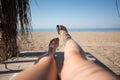 Women feet on lounge in bungalow sea view Royalty Free Stock Photo