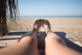 Women feet on lounge in bungalow sea view Royalty Free Stock Photo
