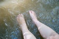 Women feet, rest relaxing foot in waterfall in tropical forest Royalty Free Stock Photo