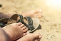 Women feet in the sand on the beach Royalty Free Stock Photo