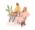 Women friends eating and talking at dining table. Happy relaxed girlfriends chatting at breakfast at home. Scene of Royalty Free Stock Photo