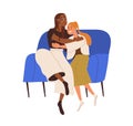 Women friends hugging on sofa. Happy girls couple of different race, sitting on couch. Biracial girlfriends embracing