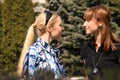 Women friends meet in a park