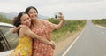 Women, friends and selfie by car on road trip with memory, profile picture and happy with kiss in countryside. Girl Royalty Free Stock Photo