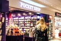 Women In front of a bookshop at the airport