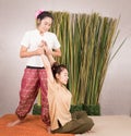 Women is getting back stretching in Thai massage