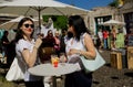 Women in glasses drinking wine at outdoor bar Royalty Free Stock Photo