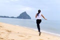 Women good shape morning running on beach