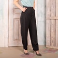 Women gray pants, torso, hand in pocket, classic fashionable clothes.