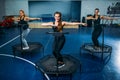 Women group on sport trampoline, fitness training
