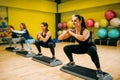 Women group on step aerobic workout Royalty Free Stock Photo