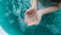 Women hand carring water in jacuzzi with turbo waterjet therapy/ wellness spa / treatment concept