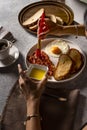 women hand doing Food Styling to Bacon and Egg