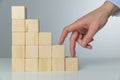 Women hand finger walk on stacked wooden block like stairs. Business development and growth concept Royalty Free Stock Photo