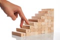 Women hand finger walk on stacked wooden block