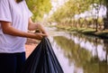 Woman hand holding black color garbage bag,Dispose waste management and plastic recycle concept,Close up Royalty Free Stock Photo