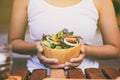 Woman hands holding and eating healthy salad for breakfast in the morning Royalty Free Stock Photo