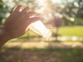 Women hand holding empty of juice bottle.