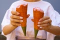 women hand holding ice cream cone. rainbow ice cream cone - hands holdling ice cream cones at hot summer day Royalty Free Stock Photo