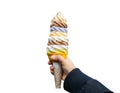 A women hand holding mixed colorful rainbow tasty ice cream soft cream cone isolated on white background, clipping path Royalty Free Stock Photo