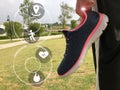 Women hand holding sport shoe with sport technology symbols. Healthy lifestyle and smart health concept