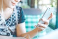 Women hand are listening to music from mobile phones. Royalty Free Stock Photo