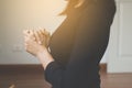 Woman with hand in praying position,Female prayer hands clasped together to pay respect or prostrate