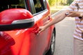 women hand presses on the remote control car alarm systems.Women hand pressing the button on the remote to lock or Royalty Free Stock Photo