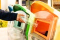 Women hand throwing away the garbage to the bin/trash, sorting waste/garbage before drop to the bin Royalty Free Stock Photo