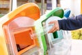 Women hand throwing away the garbage to the bin/trash, sorting waste/garbage before drop to the bin Royalty Free Stock Photo