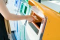 Women hand throwing away the garbage to the bin/trash, sorting waste/garbage before drop to the bin Royalty Free Stock Photo