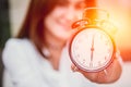 Women hand up show clock timed at 6 o& x27;clock.