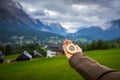 Women hand using a compass in the mountains, travel concept. Han Royalty Free Stock Photo