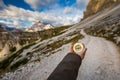 Women hand using a compass in the mountains, travel concept. Han Royalty Free Stock Photo