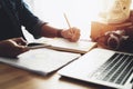 Women hand using smart pone with note paper at home office table Royalty Free Stock Photo