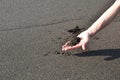 women hand on vulcano beach