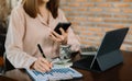 women hand working with laptop computer, tablet and smart phone in modern office with virtual icon diagram at modern office Royalty Free Stock Photo