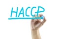 Women hand writing meaning of HACCP concept (Hazard Analysis of Critical Control Points) on white background Royalty Free Stock Photo