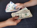 women hands exchanging European banknotes and American dollar money Royalty Free Stock Photo