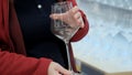 Women hands hold large wine glass. Buying dishes in store