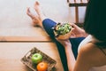 Woman hands holding and eating healthy salad for breakfast in the morning Royalty Free Stock Photo